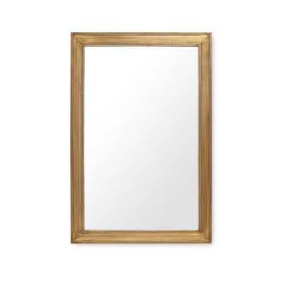 Large brass mirror with hammered edge detailing, set against a plain background.