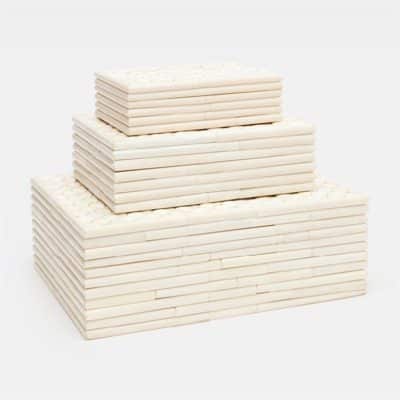 Large stack of three faux fish scale boxes with ribbed sides, available in natural bone or black horn.