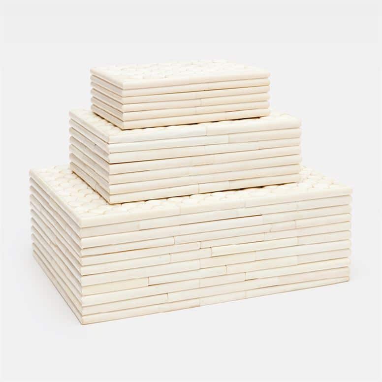 Large stack of three faux fish scale boxes with ribbed sides, available in natural bone or black horn.