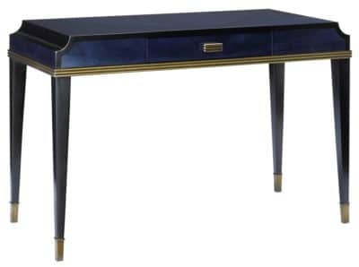 A sleek, dark blue Kalli Sapphire desk with a glossy finish and antiqued brass pulls.