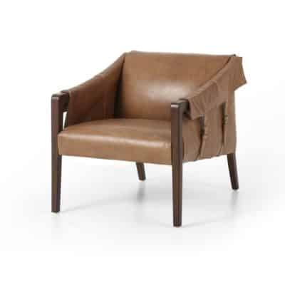 Angular leather armchair with taupe seat, brown leather draped over armrests, and buckle detail on frame.