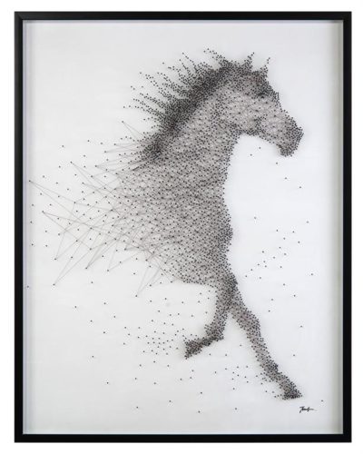 A black and white photograph captures a dynamic scene of a horse in motion The horse depicted as an abstract pattern of