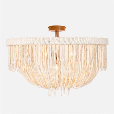A large, round chandelier with a fringe design and a light fixture at its center.