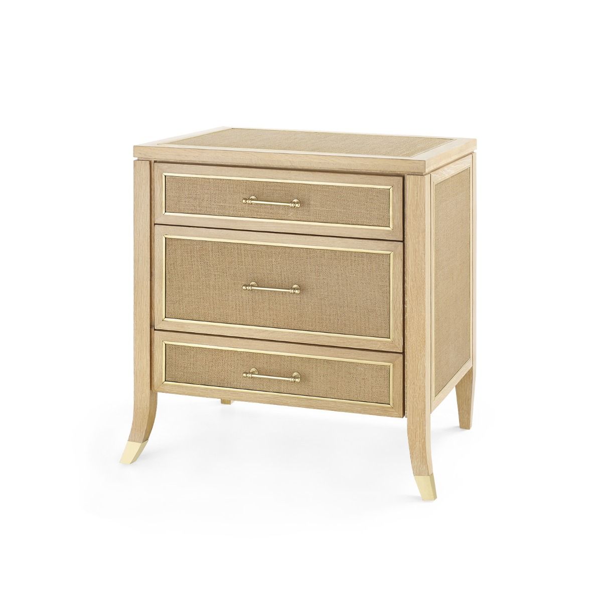 A three-drawer side table with a natural oak finish and jute panels, featuring solid cast brass pulls.