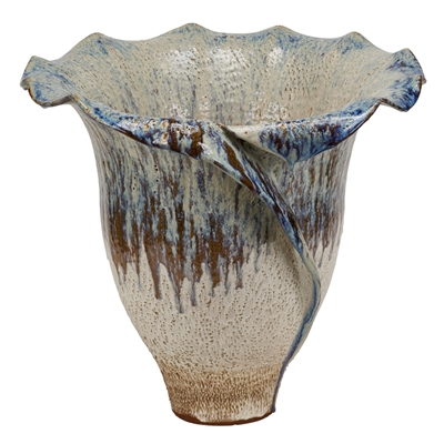 This is a handmade ceramic vase with fluted edges and a unique milk white and purple color scheme.