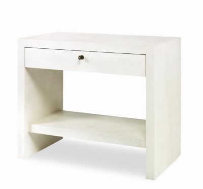 A modern white nightstand with a single drawer and open shelf, featuring antiqued brass hardware on top.