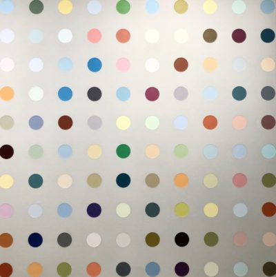 A vibrant art piece with a multitude of colorful dots on a white background, exhibiting a polka dot pattern throughout.