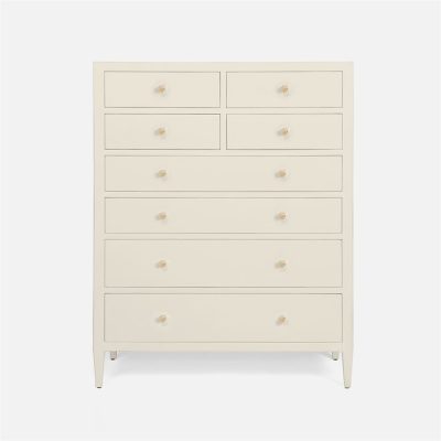 A tall, light-colored dresser with multiple drawers and a minimalist design.