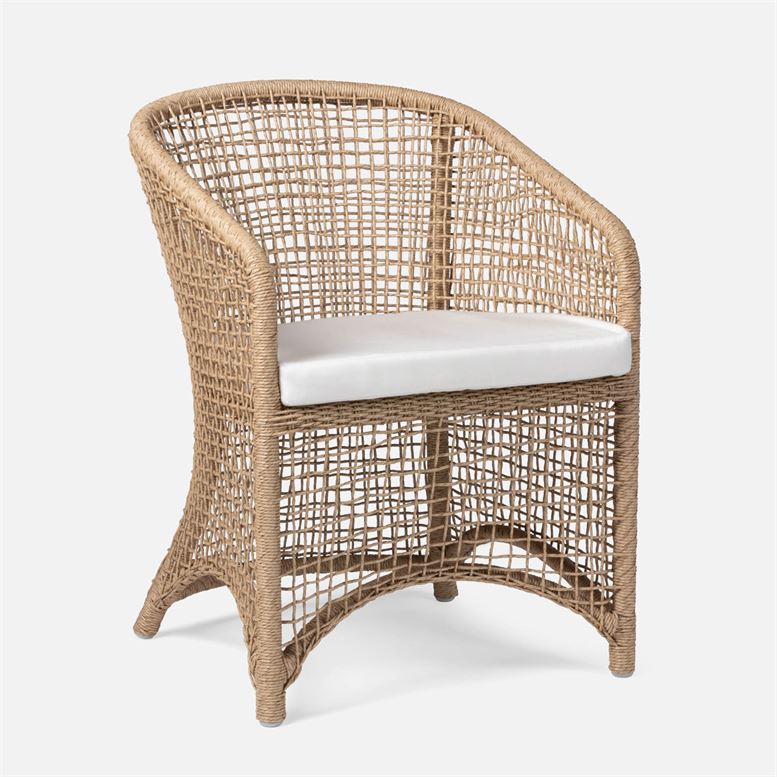 An outdoor wicker armchair with a cushioned seat featuring a natural twisted pattern and a curved frame design It is available in