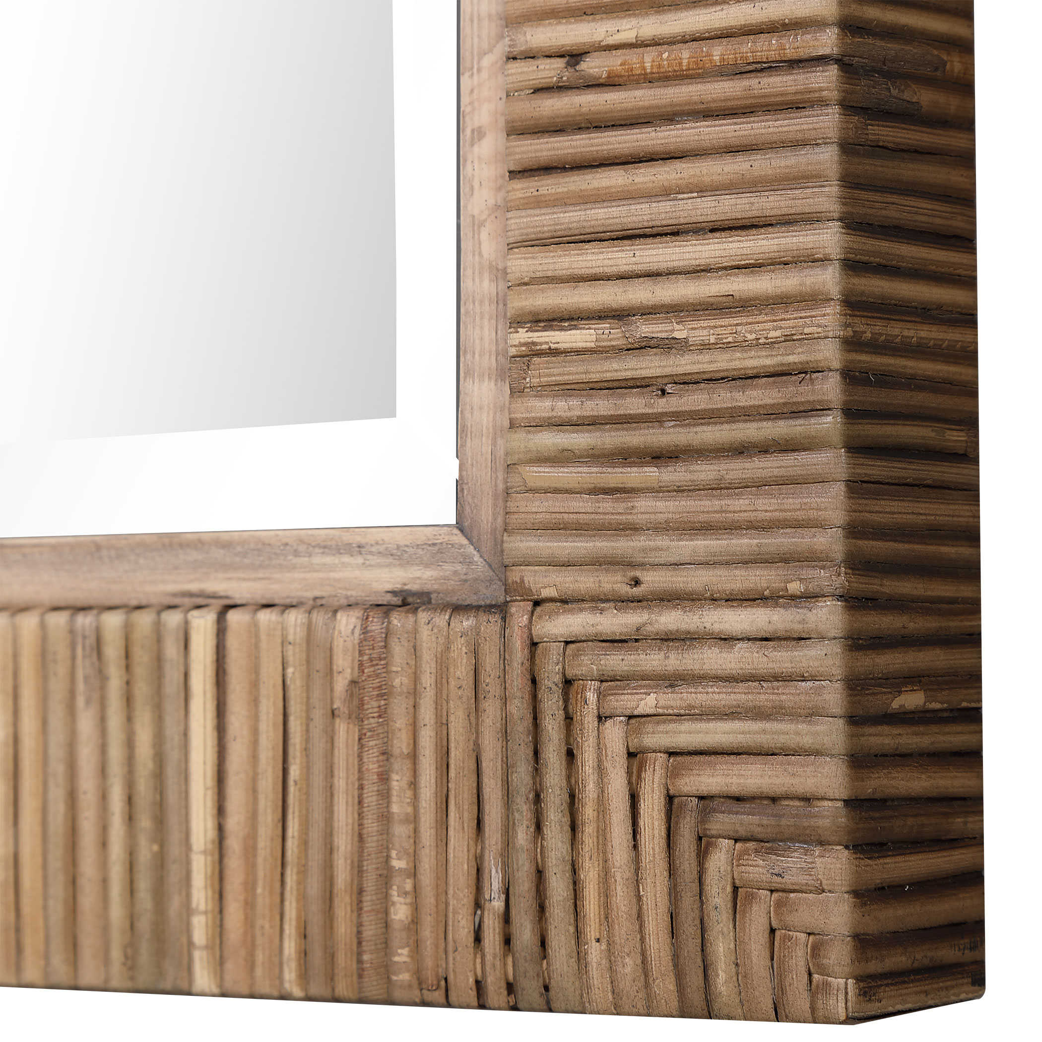 The image depicts a rectangular mirror with a unique design It features a beveled edge and is framed by strips of natural