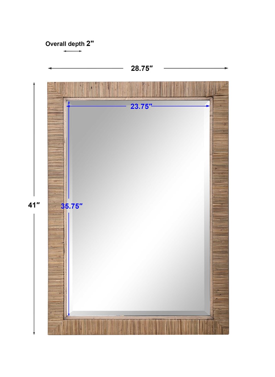 A rectangular mirror with a woven rattan frame sitting against a white wall on a flat surface measuring 20 inches by 48