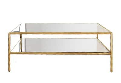 A sleek, modern coffee table with a gold leafed top and rectangular design.