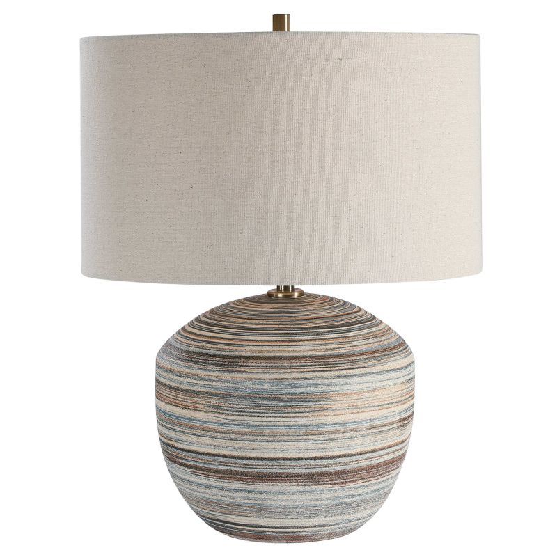 Striped ceramic table lamp with a linen drum shade and brass hardware