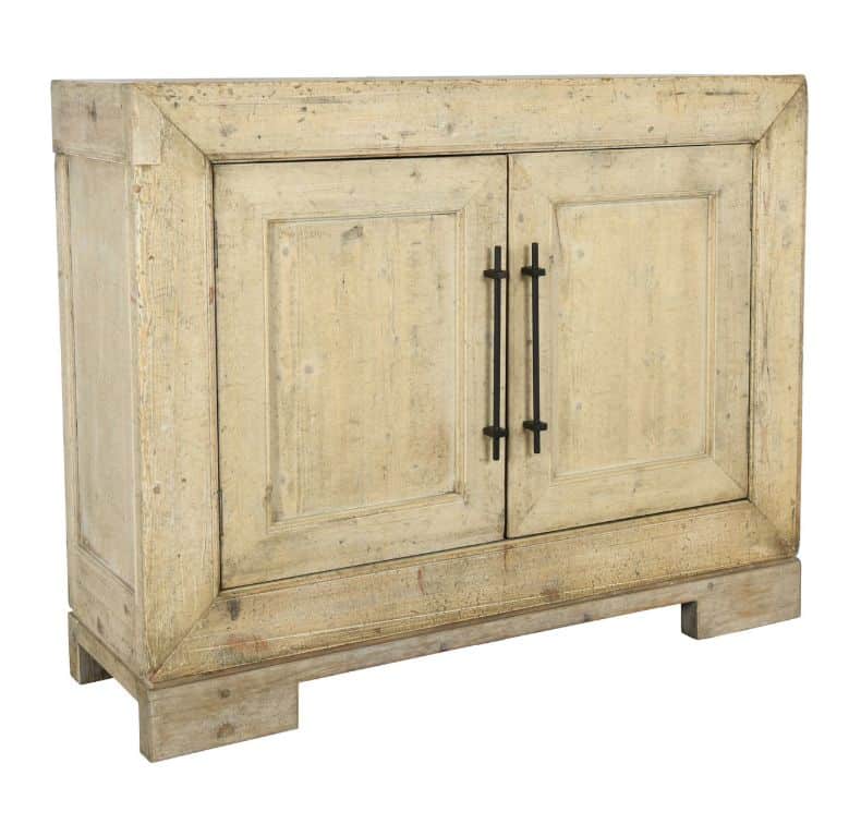 Rustic pine buffet with two doors, featuring a weathered finish and decorative hardware.