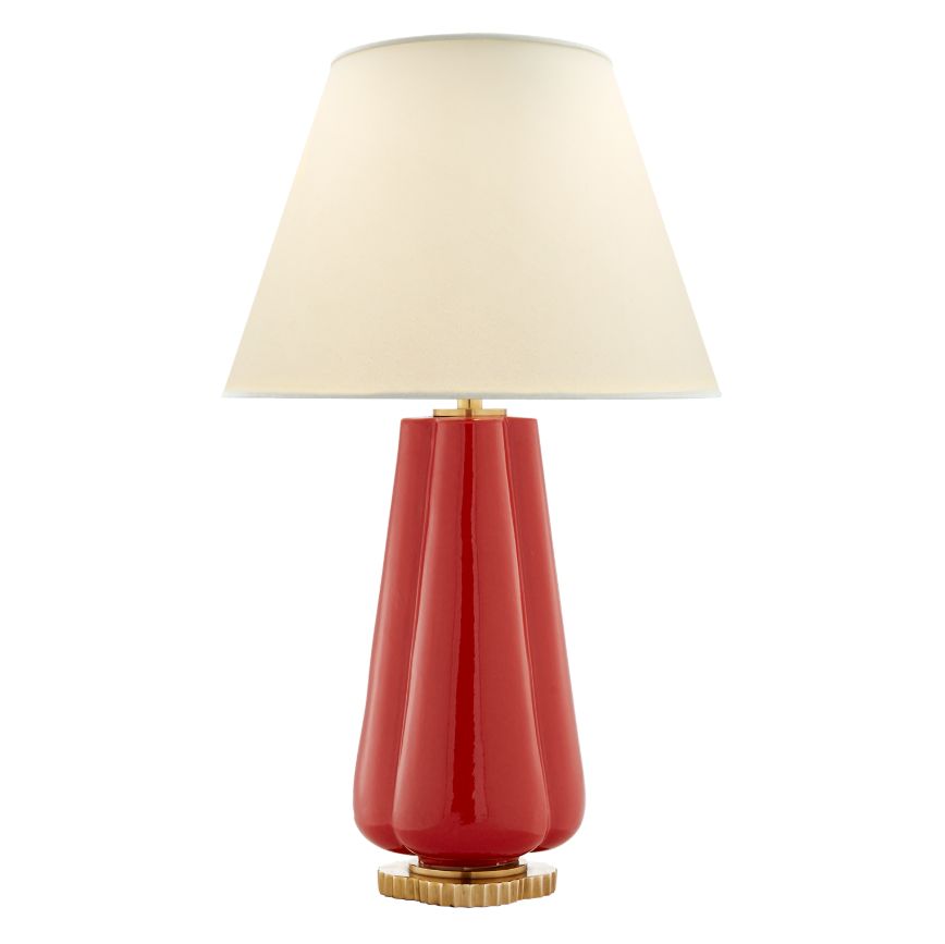 Red scalloped porcelain table lamp with gold accents and a white linen shade.