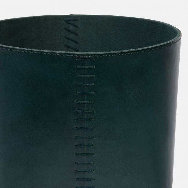 Two leather baskets with stitched detail available in aged camel dark teal light gray dusty rose or tobacco The image shows a