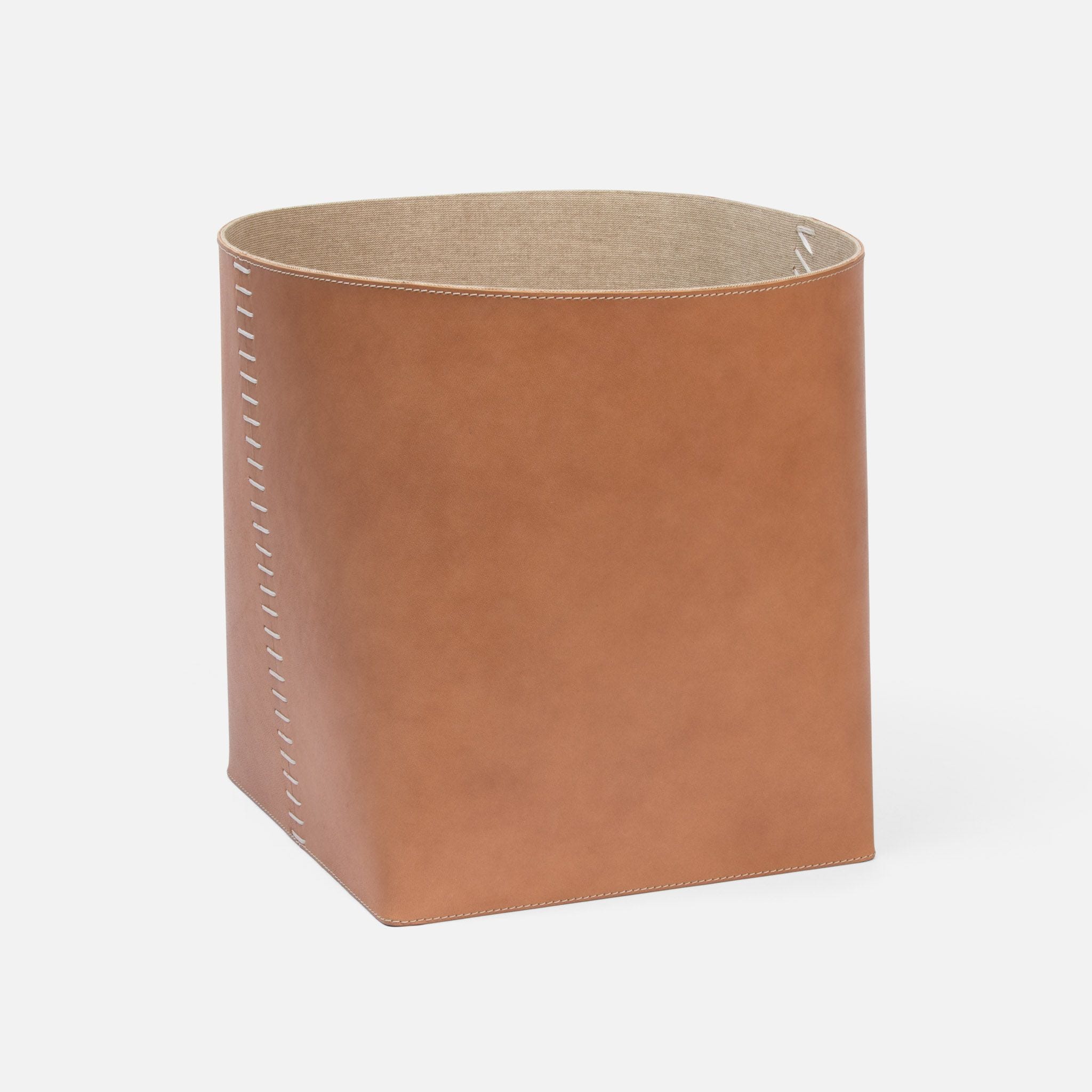 A set of two leather baskets with stitched detail available in aged camel dark teal light gray dusty rose or tobacco 10