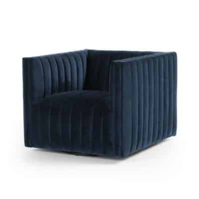 Navy velvet upholstered armchair with tufted backrest and swivel functionality.