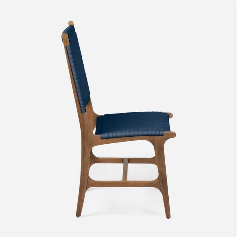 Colorful wooden chair with a navy cushion and wooden legs, available in flat white or aged natural teak finish.
