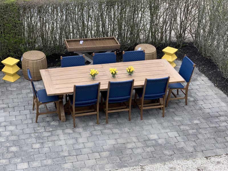 Colorful patio chairs arranged around a table, ready for outdoor dining.