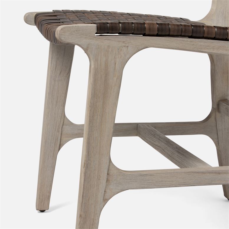 Side view of faux rattan outdoor chair in flat white color.