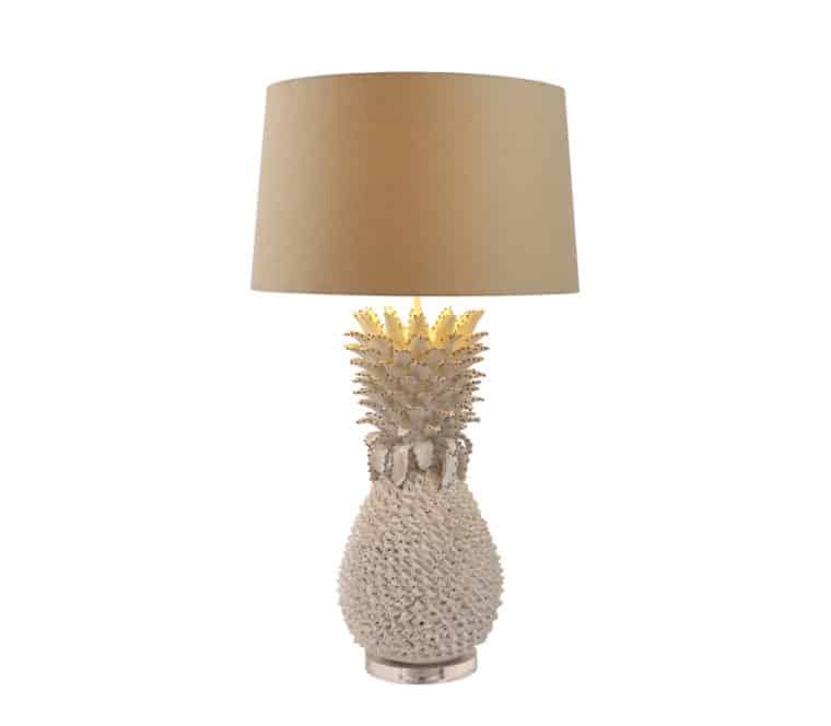 A large white pineapple lamp with a brown shade and a gold accent on the base, available in blue.
