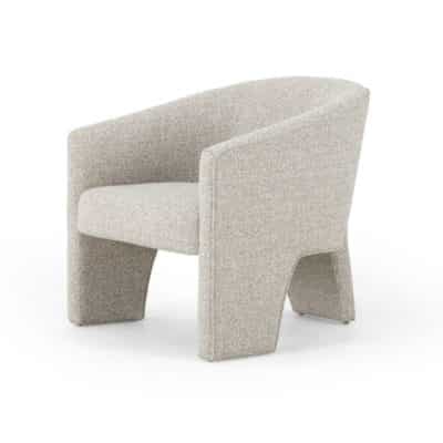 Modern three-legged armchair with plush bouclé upholstery