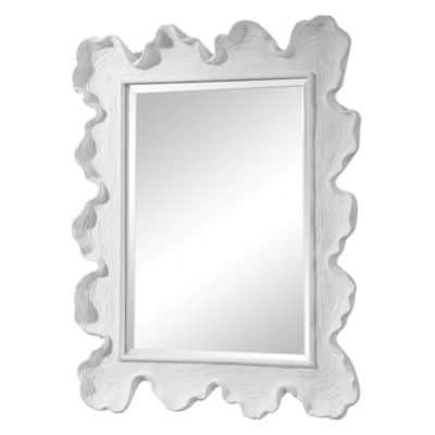 A decorative mirror with a sea fan design featuring an ornate white frame and a reflective surface that captures light and adds