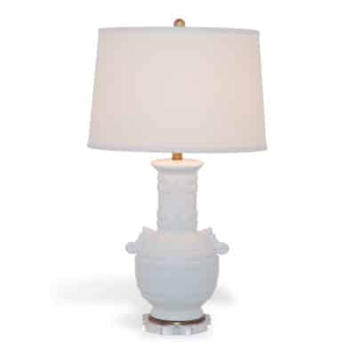 Cream crackled porcelain lamp with acrylic base, featuring a Tibetan style design.
