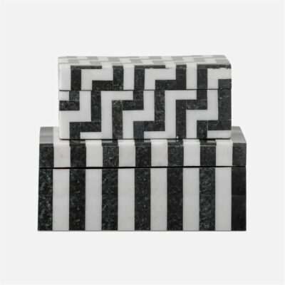 Three stacks of black and white marble boxes with geometric patterns presented against a white background The large box is on top