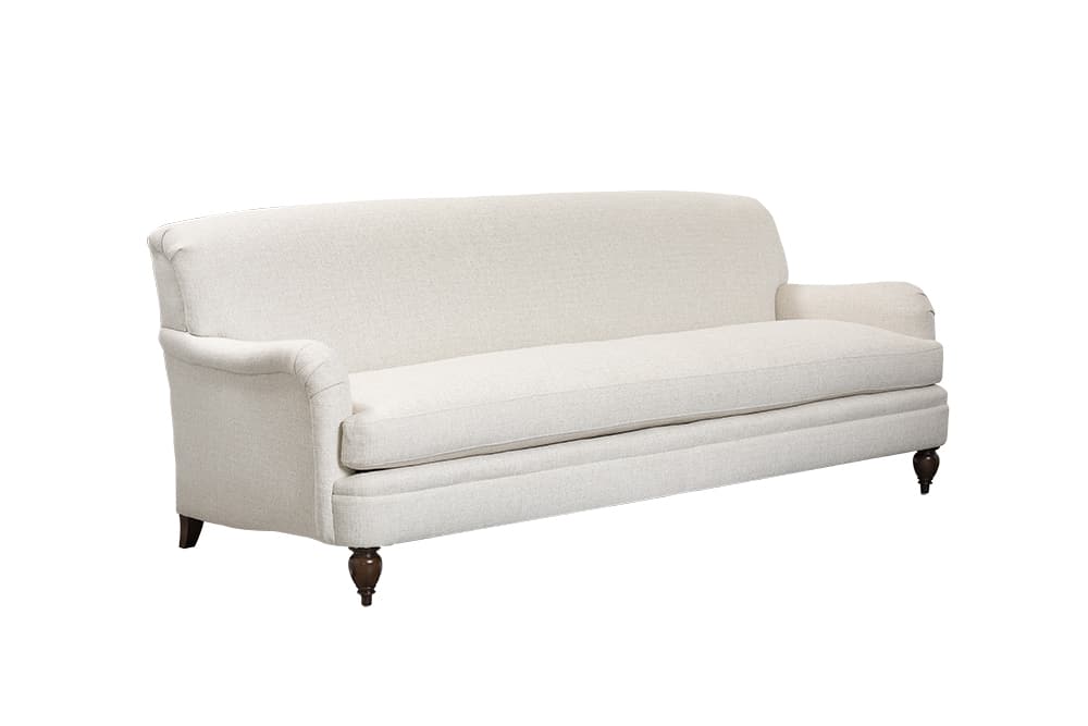 Amelia English arm sofa in alabaster with dark brown legs.