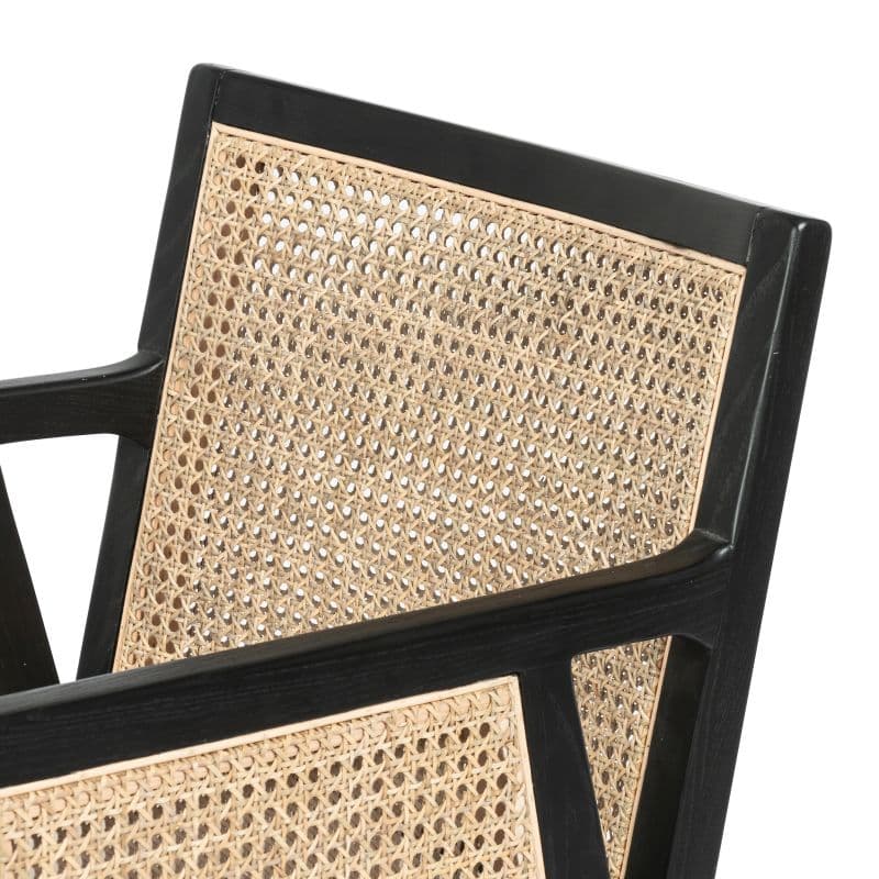 Woven seat on black stool.