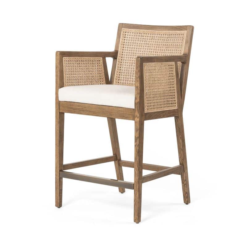 Olivia cane counter stool with brushed ebony frame and neutral linen blend seat.