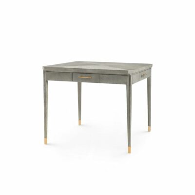 Gray oak game table with four drawers featuring brushed brass accents and soft close mechanism.