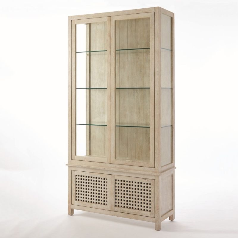 Tall lattice white washed driftwood cabinet with glass shelves and lower closed storage.