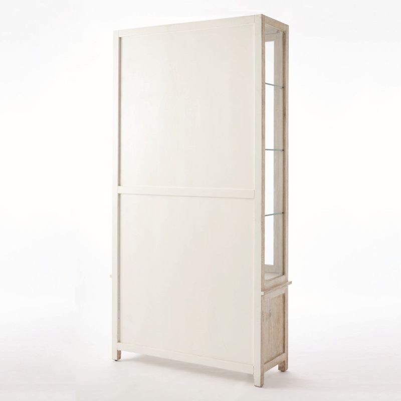 Tall lattice white washed driftwood cabinet with glass shelves and closed storage.