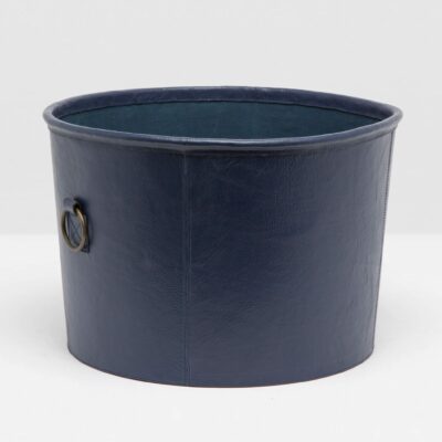 Navy leather basket with round brass handles.