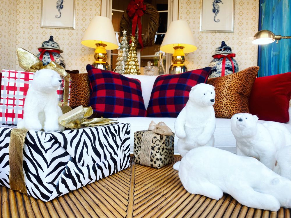 Table Top Furry Polar Bears in various poses on zebra print couch and chairs.