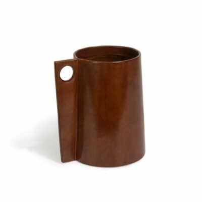 Modern leather vase with glass insert, handcrafted in a pitcher style shape with round hole handle.