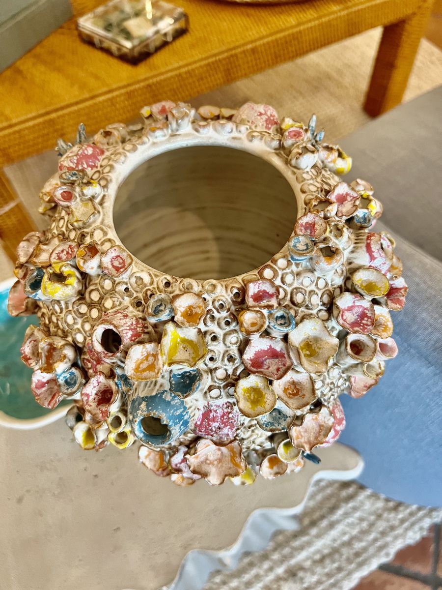 Close-up of large coral inspired stoneware vase with rainbow pastel glaze, intricate details and varied texture.