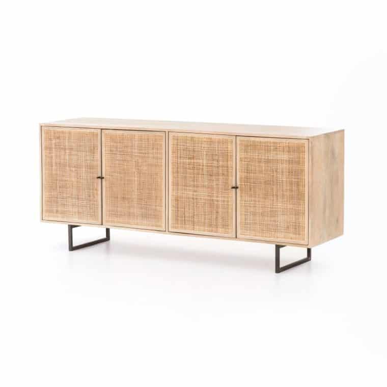 A long wooden console table with a woven texture on its doors and drawers showcasing a side view with a black metal