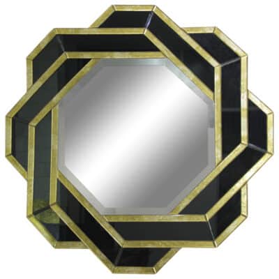 Bathroom mirror with intricate black and gold design featuring verre eglomise squares of gold leaf hand-applied to back of glass panel.