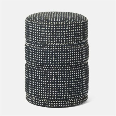 Navy and white upholstered stool with hand sewn triangles.