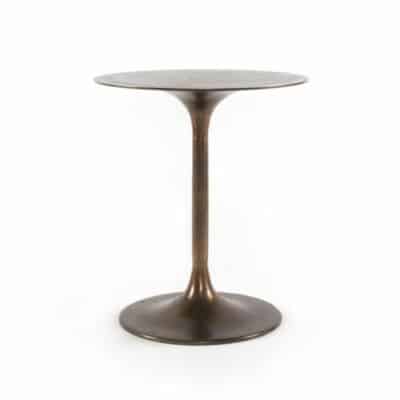A tall, sleek metal side table with a circular top, standing alone against a white background.