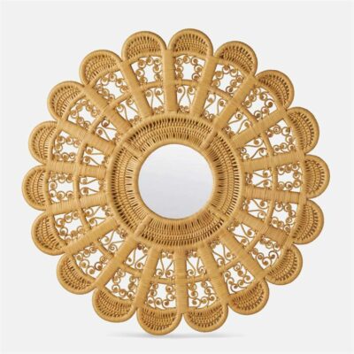 Round mirror with woven rattan frame featuring a floral motif.