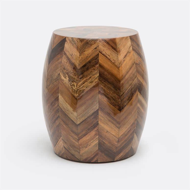 Barrel-shaped stool in natural banana bark with starburst pattern.