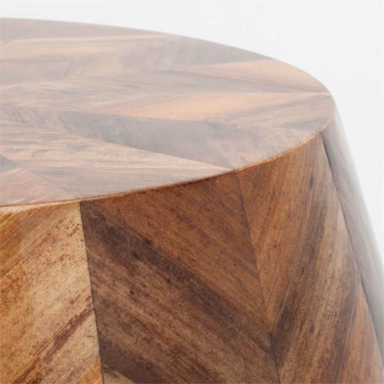 Close-up view of wooden chevron banana bark stool, showcasing starburst pattern and rich color variations from beiges to chocolates.