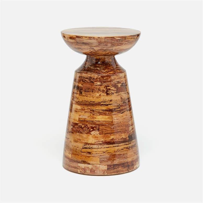Curvy tapered side table in banana bark material with varying brown tones.