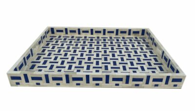 Large blue bone-shaped tray with a patterned design, placed against a white background.