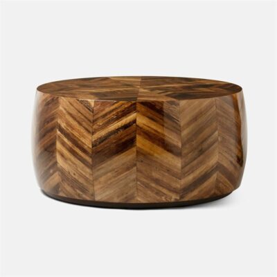 Round wooden coffee table with banana bark top, featuring geometric starburst and chevron patterns in shades of beige, brown, and tobacco.